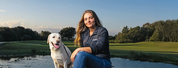 Kate Kostelyk, IgA nephropathy (IgAN) patient, and her labrador Dakoda in Mims, Florida