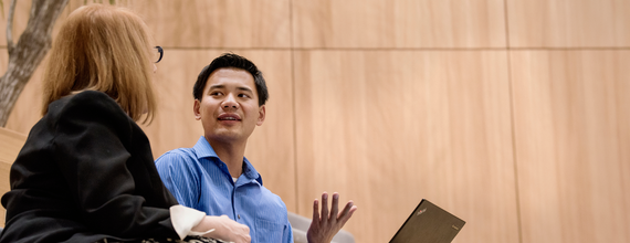 Two people talking together