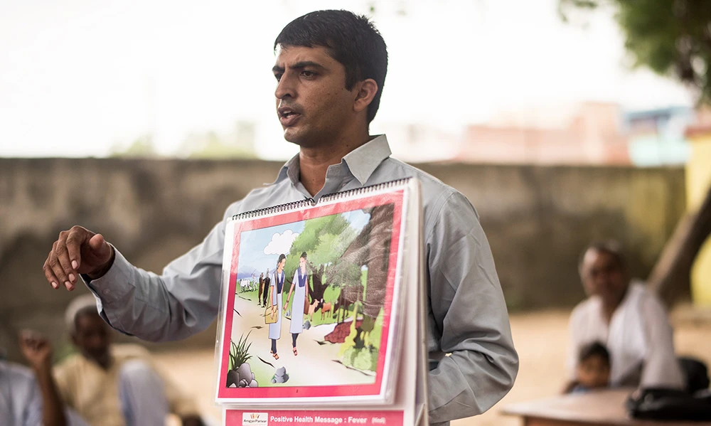 Health educator Chankey Kumar addresses people in the northern Indian village of Mulehra on disease prevention and healthy lifestyles.