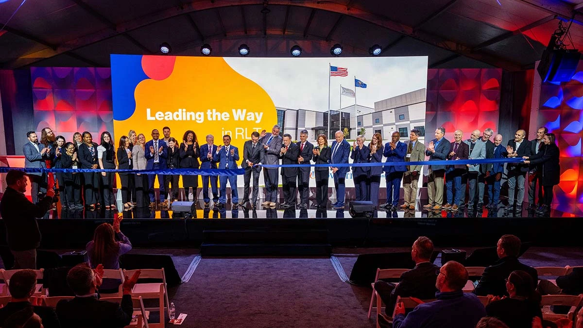 Real time photo of the ribbon-cutting ceremony, including NVS executives