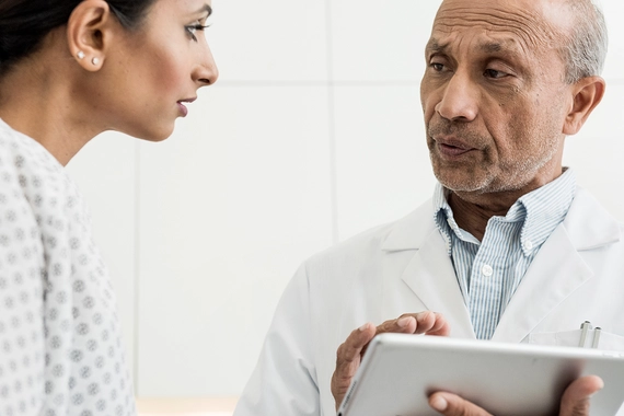Female patient and male doctor discuss test results
