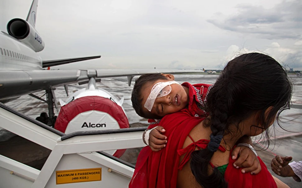 Sunita Singh holds her child