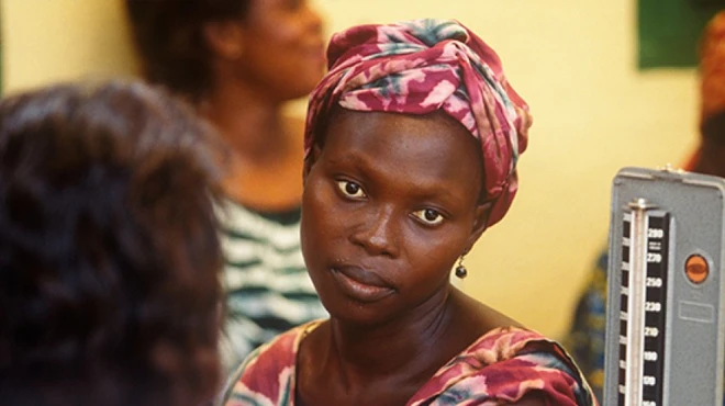 A patient gets her blood pressure taken