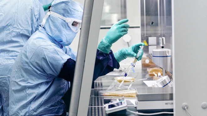 A process operator performs process operation in a biosafety cabinet