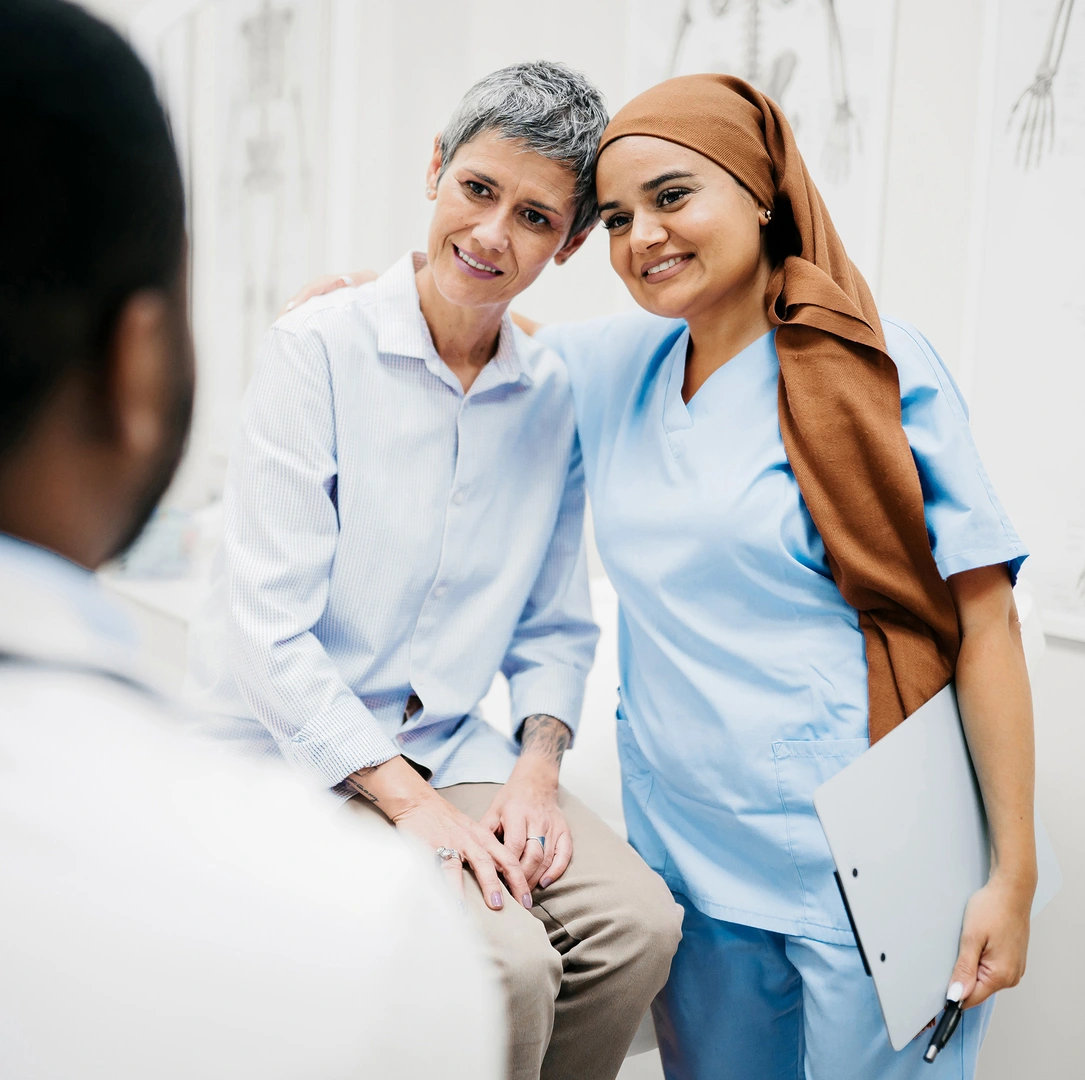 Nurse and patient exchanging a warm moment