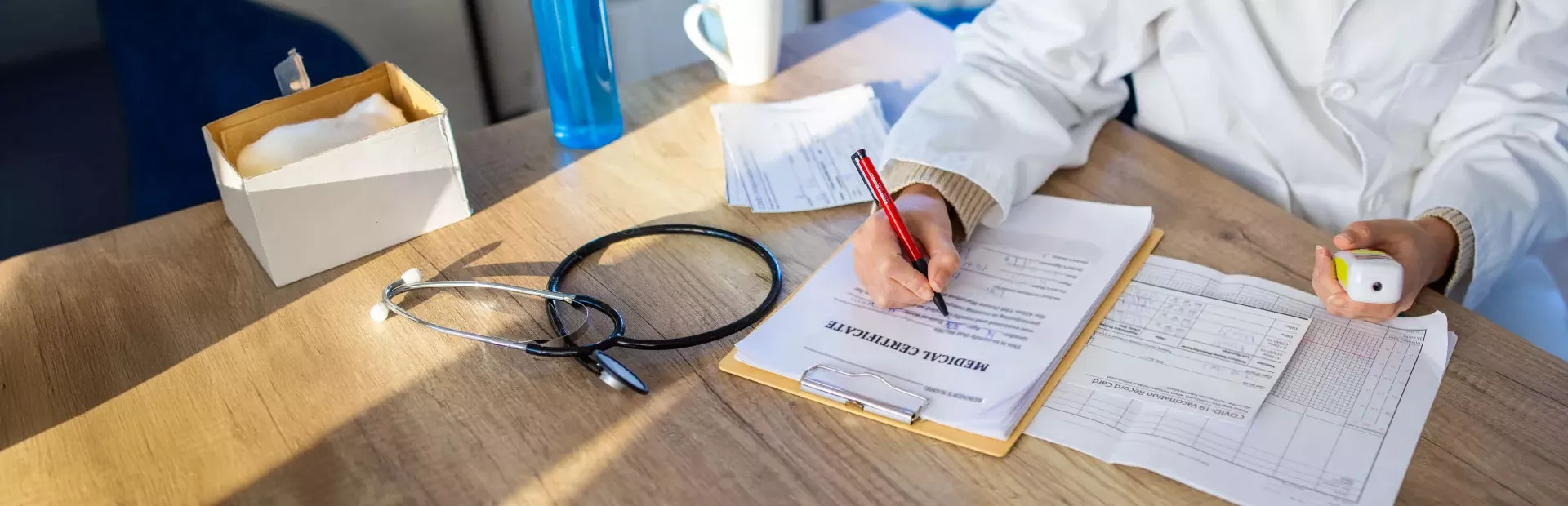 healthcare professional signing papers