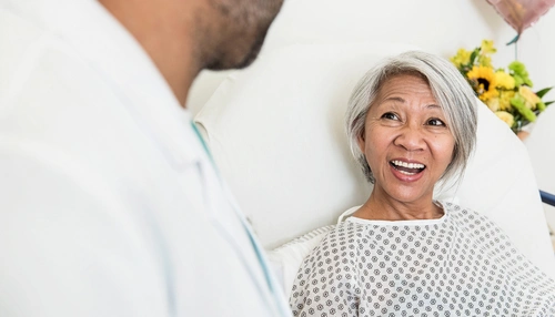 Patient smiling at doctor image