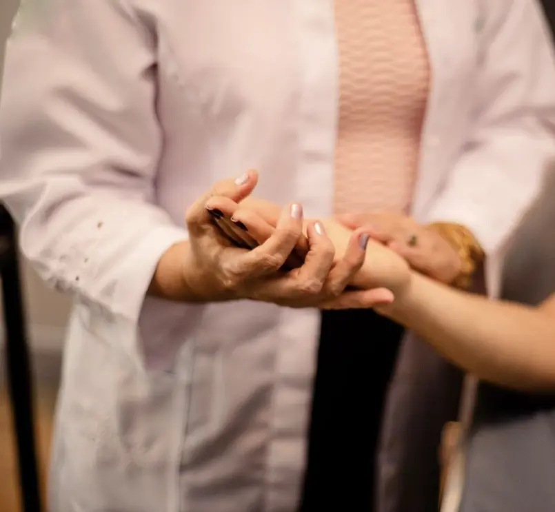 Doctor performing skin exam