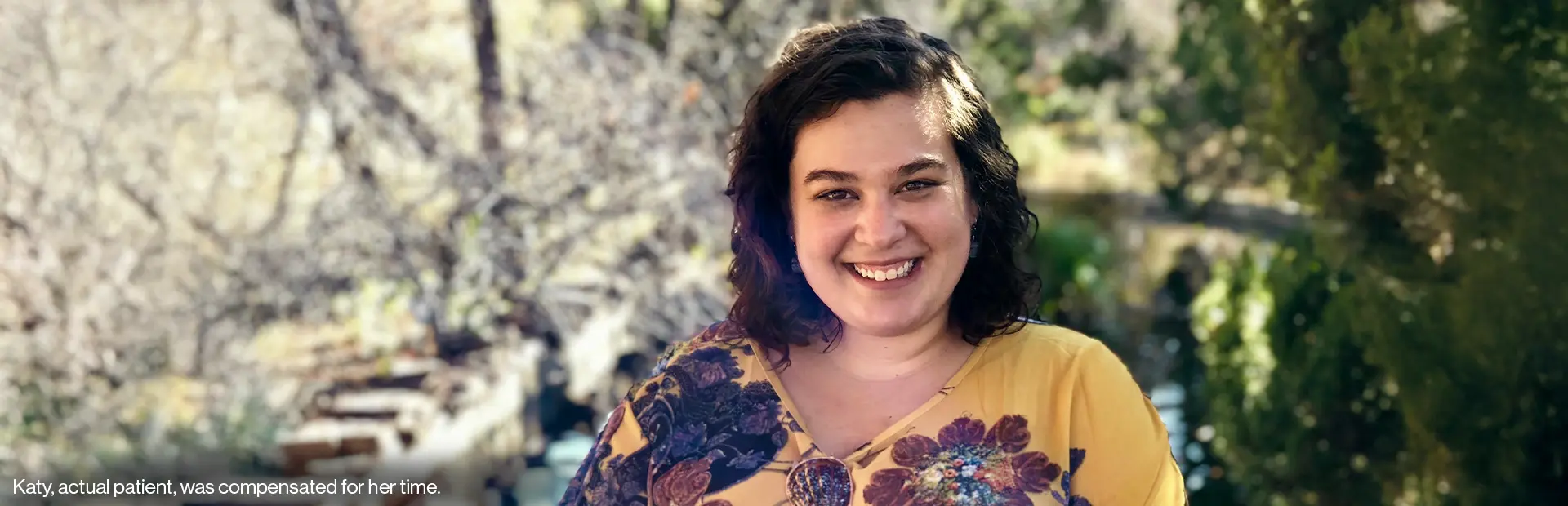 Katy, living with HS, smiling at camera