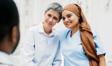 nurse and patient exchanging warm moment