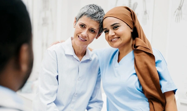 nurse and patient exchanging warm moment