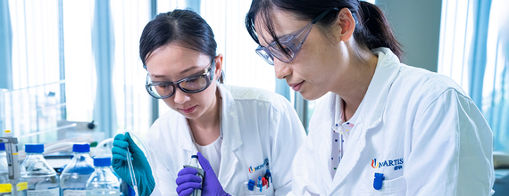Two scientists performing chemical analysis 