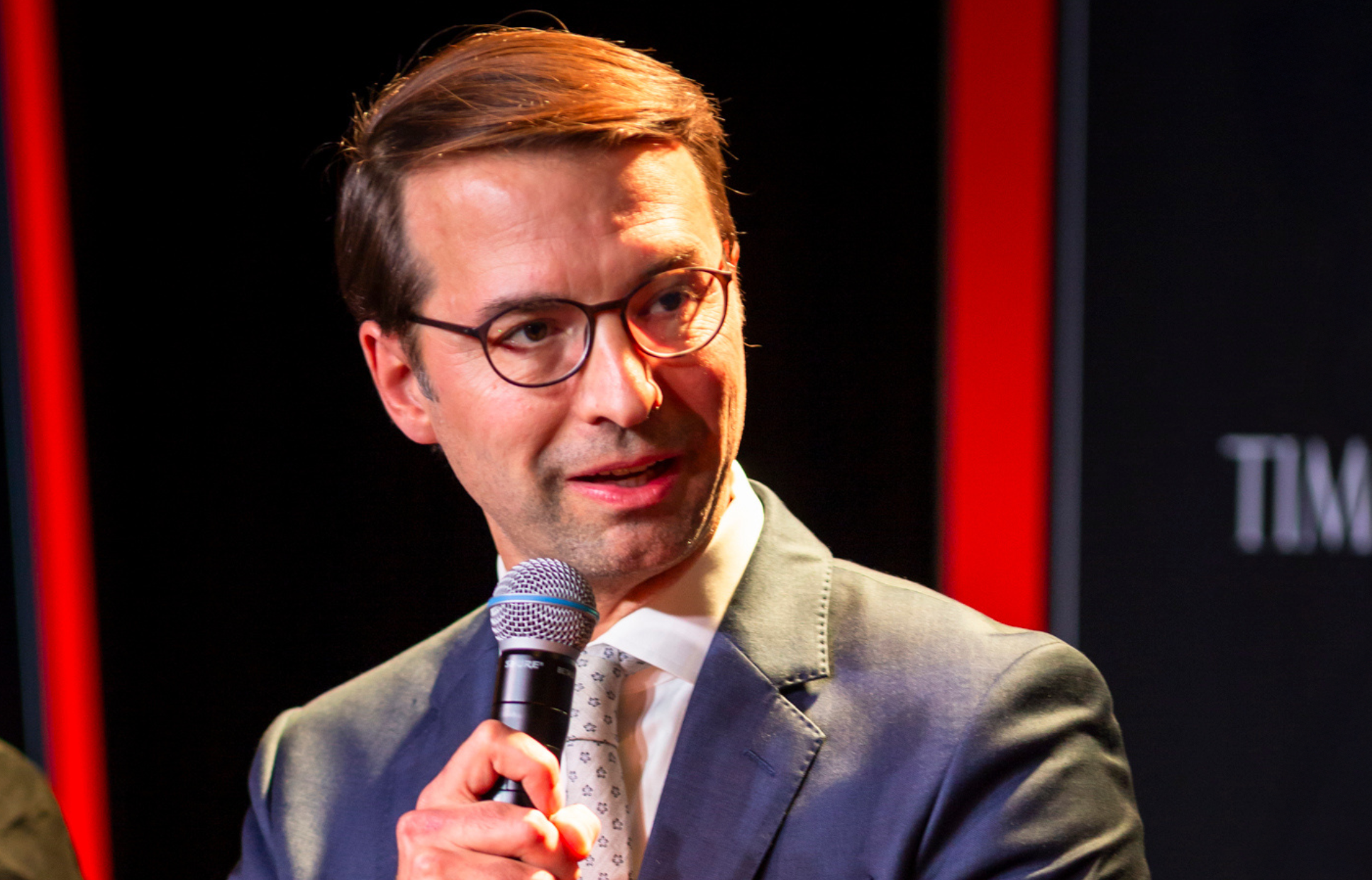 A man speaking into a microphone