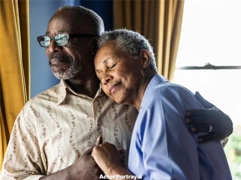 A couple embracing and holding hands