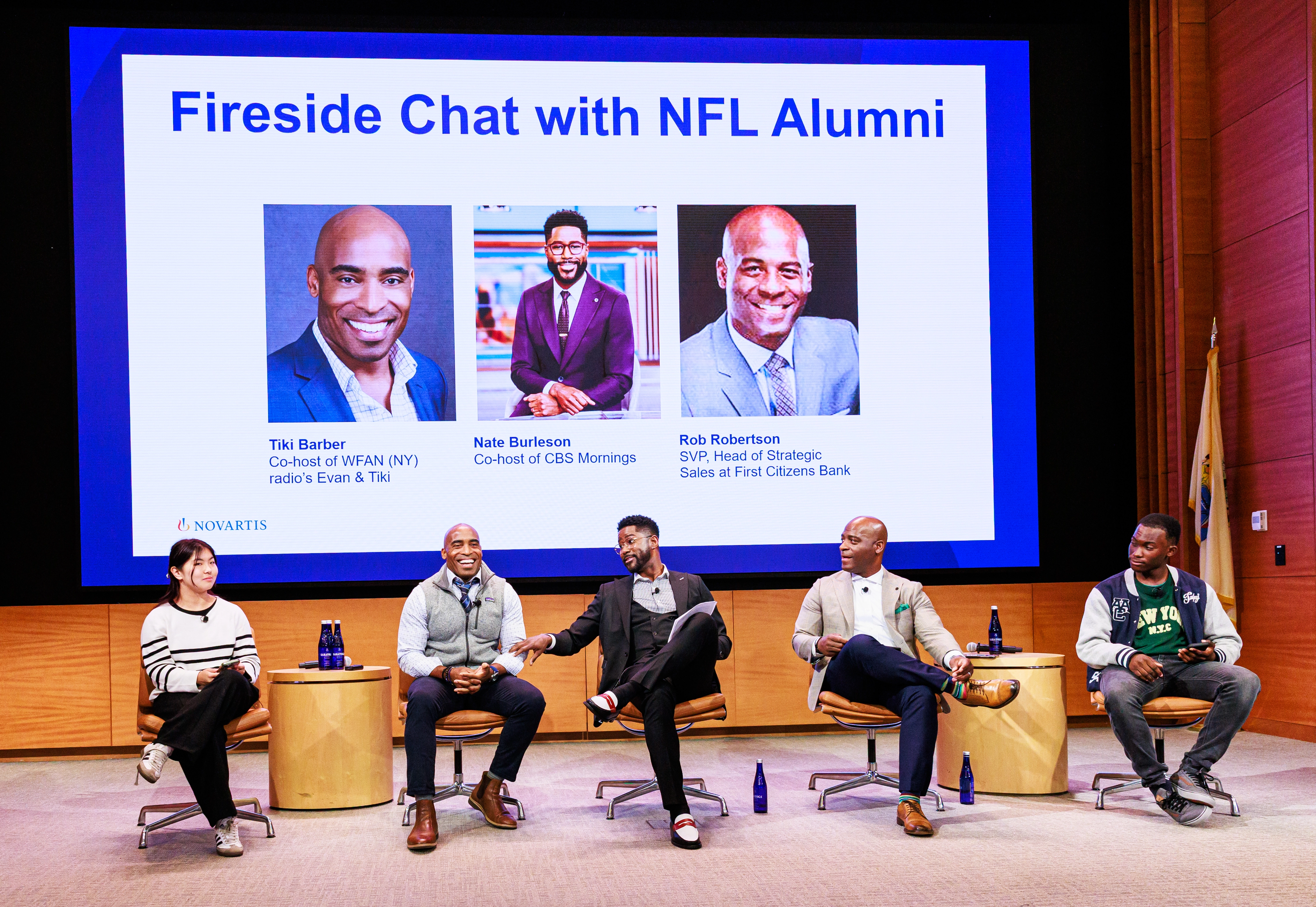 Former NFL players with students on panel