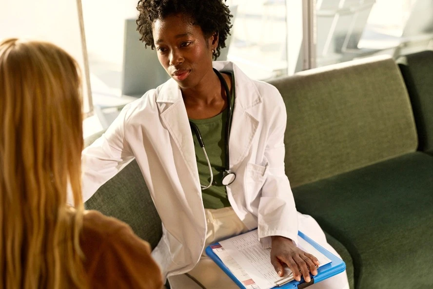 Doctor consulting with patient at healthcare clinic