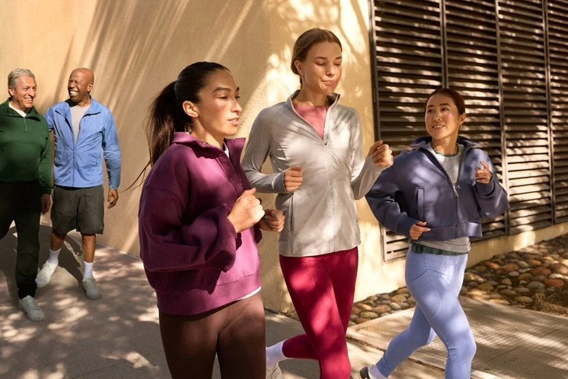A group jogging outdoors in casual sportswear