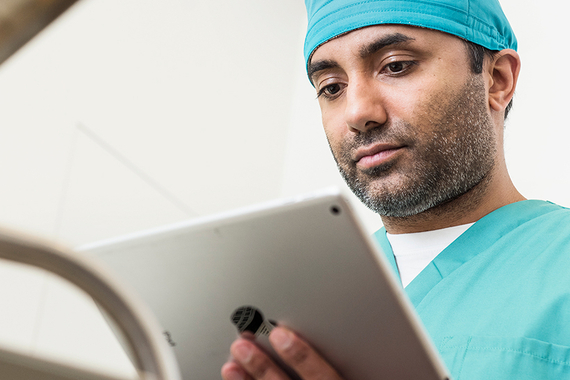 Doctor looking at ipad