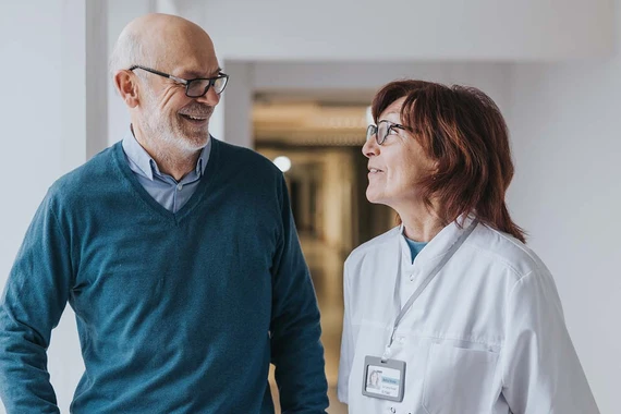 Doctor and patient talking in hallway
