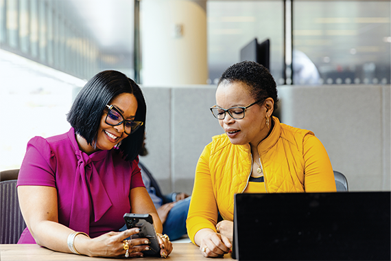 Two women looking at a phone