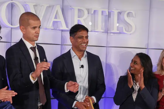 Novartis CEO Vas Narasimhan cuts the ribbon alongside others at the Carlsbad site opening ceremony.