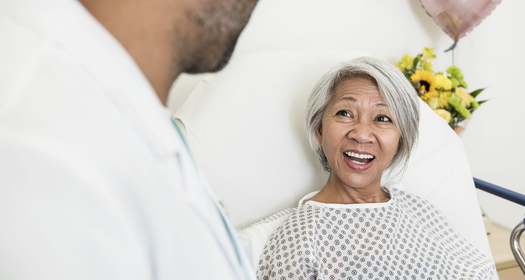 Patient smiling at doctor image