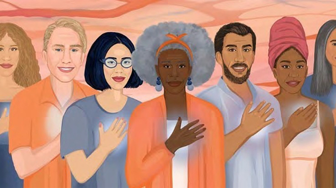 People of all ages and races standing together with their hand on their heart