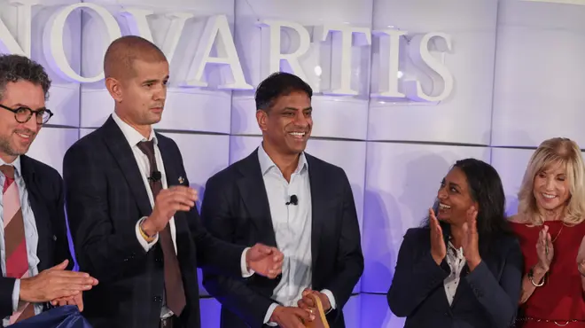 Novartis CEO Vas Narasimhan cuts the ribbon alongside others at the Carlsbad site opening ceremony.